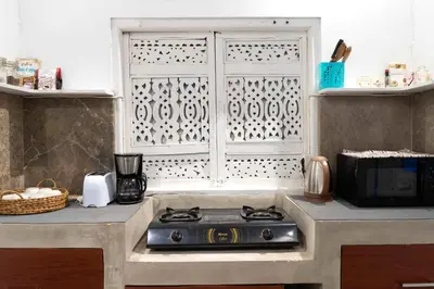 a kitchen with a stove and a window at Dreams Villa -Private Pool, Fast Wifi, 2 min to Double Six Beach in Seminyak