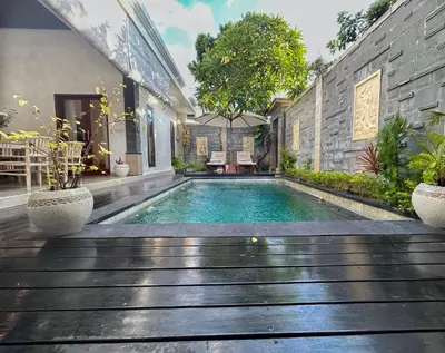 a swimming pool in the middle of a house at CASA BISMA - 3 Bedroom Villa with Pool in LEGIAN in Seminyak