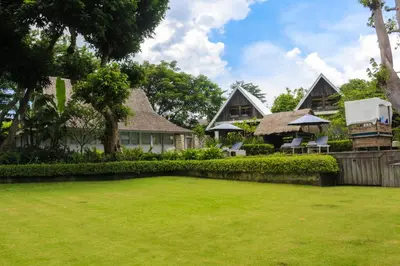 a large yard in front of a house at Chanteak Bali - Stone House 1 in Jimbaran