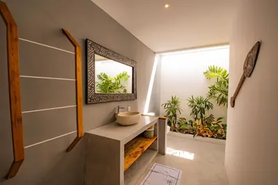 a bathroom with a sink and a mirror at Hedonia Luxury Villas in Seminyak