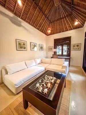 a living room with a couch and a table at Istana Semer - Balinese Style Private Event Villa, with Large Pool, Gardens and Cook - Near to Canggu & Seminyak in Kerobokan