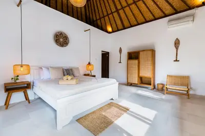 a bedroom with a white bed in a room at Villa Chandika - 4 BDR Villa with private Pool, walk to the beach in Seminyak