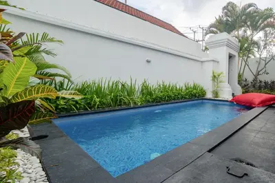 a swimming pool in the backyard of a house at Casa Jinah 1 I Simply Modern Twin Villas (2BR) with Private Pool in Seminyak