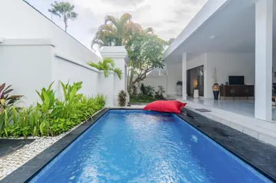 a swimming pool in the backyard of a house at Casa Jinah 2 I Simply Modern Twin Villas (2BR) in Bidadari in Seminyak