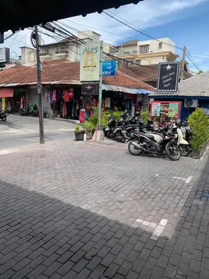a group of motorcycles parked on a street at Fat Yogi Cottages in Kuta