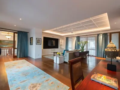 a living room with a couch and a table at Villa Windu Asri in Seminyak