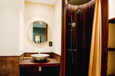 a bathroom with a sink and a mirror at Tanaga CoLiving in Seminyak