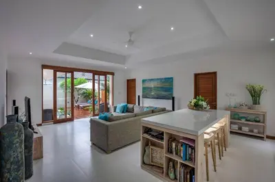 a living room with a couch and a table at Central Seminyak, 3BR, Ensuites, Sleep 6, Peaceful in Seminyak