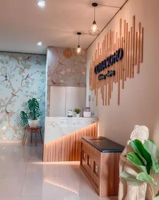 a salon with a counter in a room at Olivia SOHO Guest House in Legian