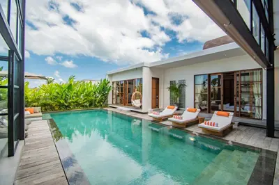a swimming pool in a villa with a house at Villa Mango 2 - Amazing 4-bdr Villa in Berawa ! PERFECT LOCATION in Canggu