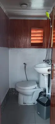 a bathroom with a toilet and a sink at Celebbest in Kuta