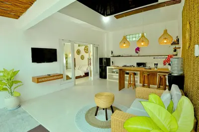 a large living room with a kitchen and a living room at Villa Elijah in Seminyak
