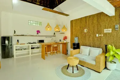 a living room with a couch and a table at Villa Elijah in Seminyak
