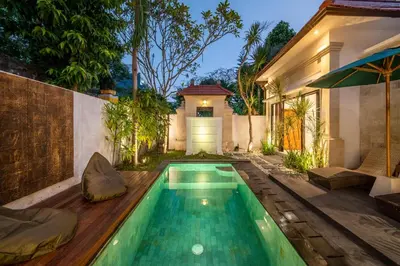 a swimming pool in the backyard of a house at Villa Banua Seminyak in Seminyak