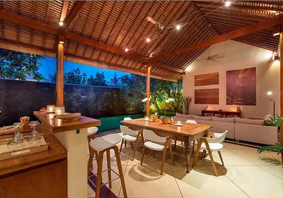 a kitchen and dining room with a table and chairs at Villa Andalas in Seminyak