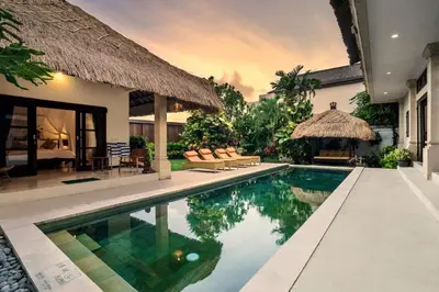 a villa with a swimming pool and a resort at Villa Gading by Alfred in Bali in Seminyak