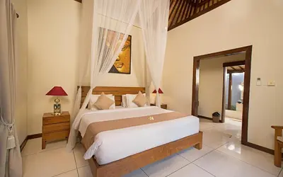 a bedroom with a large bed in a room at Villa MD 3 bedroom, Sunny Pool in Eat st location in Seminyak