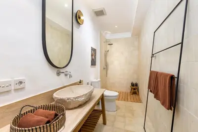 a bathroom with a sink and a toilet at Villa Gauguin by Villa Finder in Seminyak