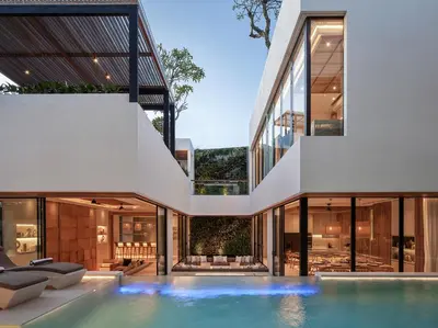 an external view of a house with a swimming pool at Villa Nini Elly by Elite Havens in Canggu