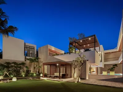 a large white house with a tree in front of it at Villa Nini Elly by Elite Havens in Canggu