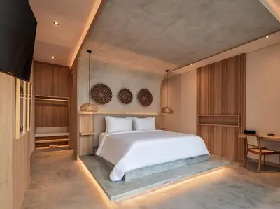 a bedroom with a white bed and a desk at Villa Nini Elly by Elite Havens in Canggu