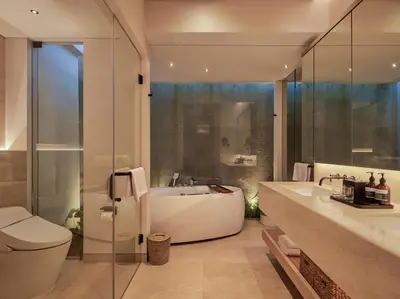 a bathroom with a tub and a toilet and a sink at Villa Nini Elly by Elite Havens in Canggu