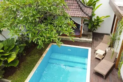an overhead view of a swimming pool in a garden at Elvano villa in heart of seminyak and near beach in Seminyak