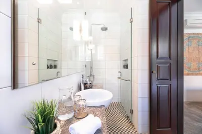 a bathroom with a sink and a mirror at Villa Rua - Stylish luxury, tranquil location in Legian, walk to beach in Seminyak