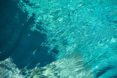 a close up of the blue water with bubbles at Villa Tahi - Stylish luxury, tranquil location, walk to beach in Legian