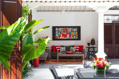 a living room with a couch and a table at Villa Tahi - Stylish luxury, tranquil location, walk to beach in Legian