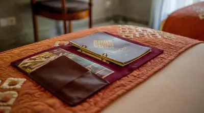 a book sitting on top of a table at Bracha Villas Bali in Seminyak