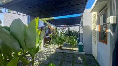a porch of a house with plants in it at Andewi Homestay RedPartner - Minimum Stay 30 Nights in Pesanggaran