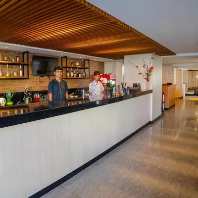 two people standing at a counter in a kitchen at The Sun Hotel & Spa Legian in Legian