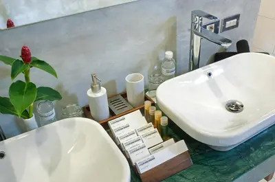 a bathroom with a sink and a counter with a plant at 4BR Villa Kamis - Minggu Villas Seminyak in Seminyak