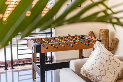a table with birds on it next to a couch at NEWLY RENOVATED trendy 4bd Pvt villa in Seminyak in Seminyak