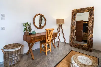 a dressing room with a desk and a mirror at Miracle villa Canggu in Canggu