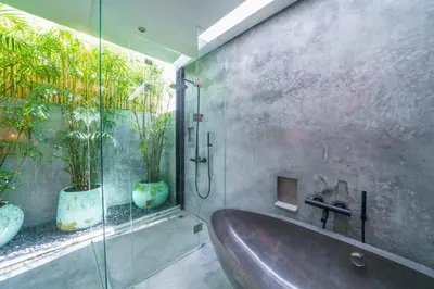 a bathroom with a tub and a glass shower at Villa Bali Townhouse 3 - Modern 2BR Villa with pool - PERFECT LOCATION in Canggu