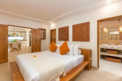 a bedroom with a large bed in a room at Villa Lisabella by Villa Finder in Seminyak