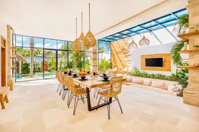 a dining room with a table and chairs at Villa Dublin - Luxury 5 BDR w Jacuzzi & Pool in Seminyak