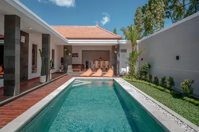 a swimming pool in the backyard of a house at Amazing Villa in Oberoi Top Location in Seminyak
