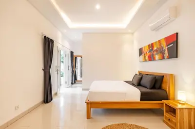 a bedroom with a king sized bed in a room at Amazing Villa in Oberoi Top Location in Seminyak