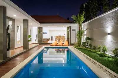 a swimming pool in the backyard of a house at Amazing Villa in Oberoi Top Location in Seminyak