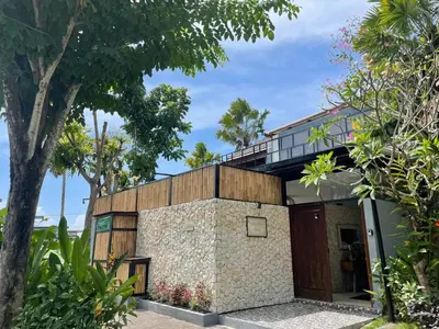 a building with a balcony on top of it at Modern Balinese Villa with Scenic View in Nusa Dua