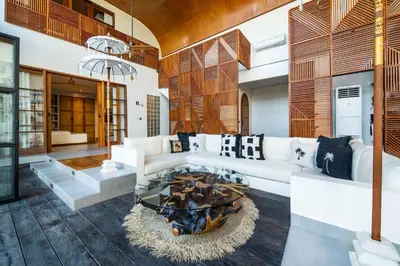 a living room with a couch and a fire pit at Villa Yukiko Canggu in Canggu