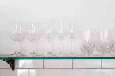 a row of wine glasses sitting on a shelf at Villa Sintra - 2 BR luxury in tranquil location, walk to beach in Seminyak
