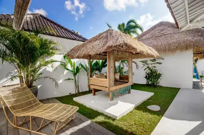 a gazebo in the yard of a house at Villa Surga Blue by Alfred in Bali in Seminyak