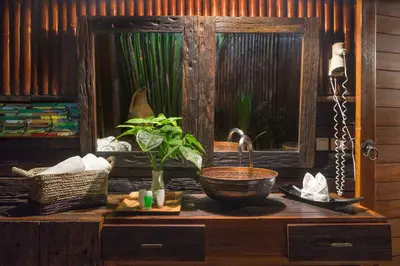 a wooden table with a sink and a fish tank at Ocean Star Villa Four Bedrooms Seminyak in Seminyak
