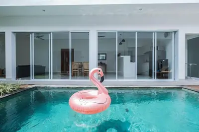 a pink flamingo in a swimming pool in a house at Villa Akmali Seminyak Drupadi 2 Bedrooms w/Pool 5mins to Beach in Seminyak