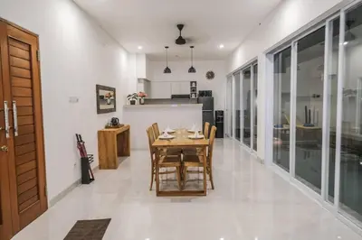 a kitchen and dining room with a table and chairs at Villa Akmali Seminyak Drupadi 2 Bedrooms w/Pool 5mins to Beach in Seminyak