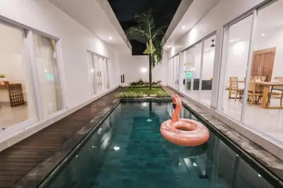 a swimming pool with a pink flamingo in a house at Villa Akmali Seminyak Drupadi 2 Bedrooms w/Pool 5mins to Beach in Seminyak